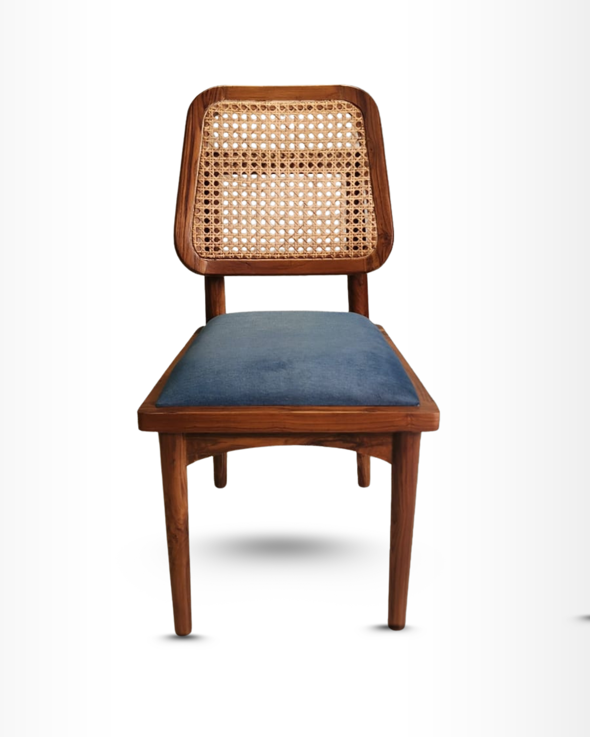 Wooden chair with wicker backrest and blue cushion on a white background